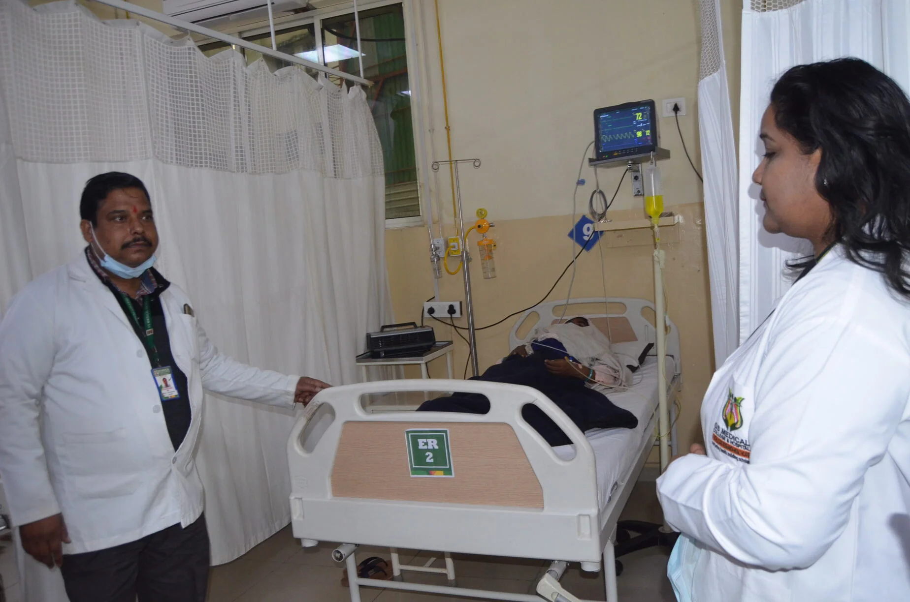 Two people with one patient with ICU Bed